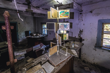 Interior of ruined post office in Krasne, small village located in Chernobyl exclusion area, Ukraine