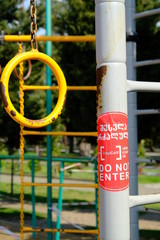 Street exercise equipment is closed for access. Georgian inscription "Do not enter" Prohibition in connection with the coronovirus. Limitations to minimize contact with surfaces. Spring is the day. Bo