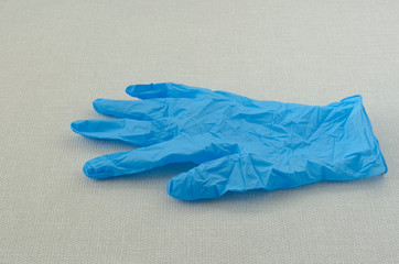 Blue medical glove, hand protection concept.