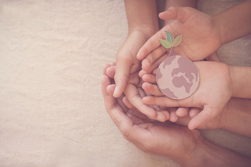 Hands holding growing tree on earth, save planet, earth day, ecology environment, climate emergency...