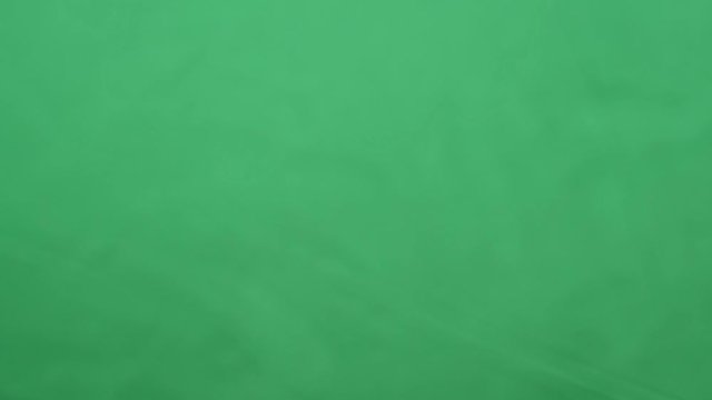 potato chips in free fall on a green background. Slow motion. Pringles