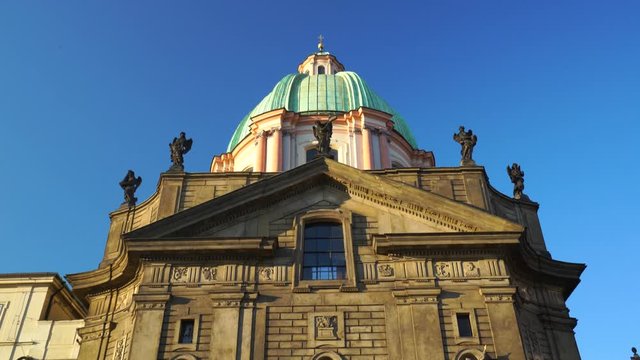 Church of saint Francis of Assis near Charles Bridge in Prague, Czechia. 4K Tilt up to blue sky.