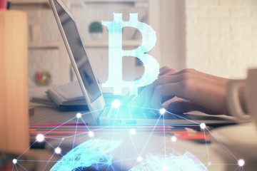 Double exposure of woman hands typing on computer and crypto market theme hologram drawing....