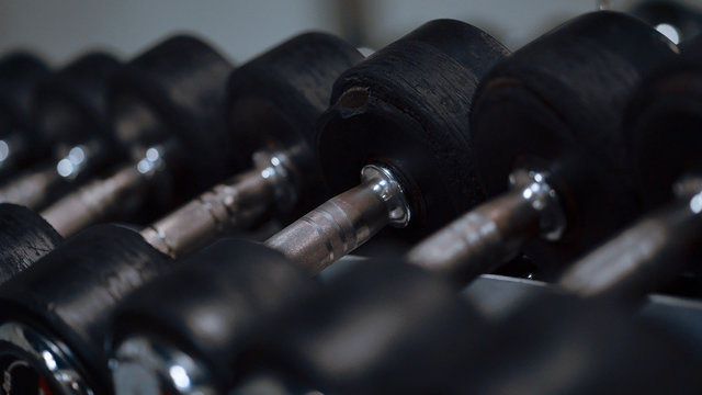 Row of barbells in a gym - lifestyle photography