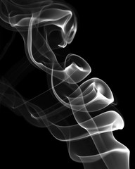 White smoke on a black background. Abstract artistic design.