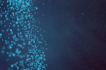 light blue a lot of flying festival glitters bokeh texture - nice abstract photo background