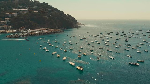 Spain Costa Brava Mediterranean coastline panning from the sea shore, Canyelles Grosses, Roses, Catalonia