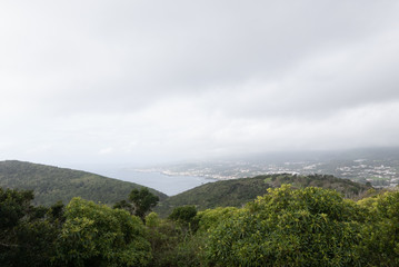 Fog over Terceira Island with green hillside.  