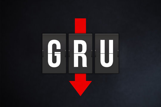 S&atilde;o Paulo International Airport IATA code (GRU). Split-flap airport terminal alphabet and down red arrow on black background. Air traffic and aviation industry fall concept..