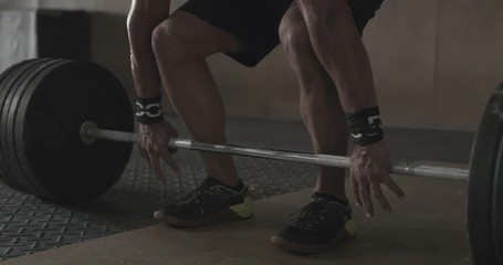 Man doing weightlifting in gym - Powered by Adobe