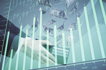 Multi exposure of financial graph drawing hologram and USA dollars bills and man hands. Analysis concept.
