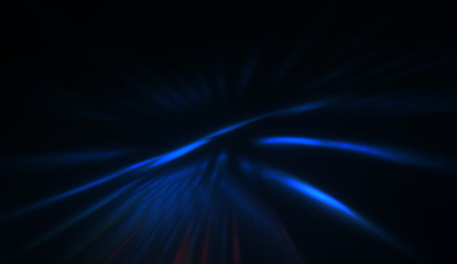 Light particles in motion, creating a burst of glowing multicolored rays on a black background. Energetic glow lights wallpaper.