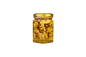 Honey with nuts in a jar, isolate on a white background