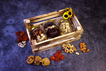 Homemade granola from mix of cereals barley, oat, rye, bran with dry fruits, nuts and seeds in a...