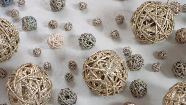 Christmas composition consisting of vine balls. 4K resolution trucking shot. Top view.