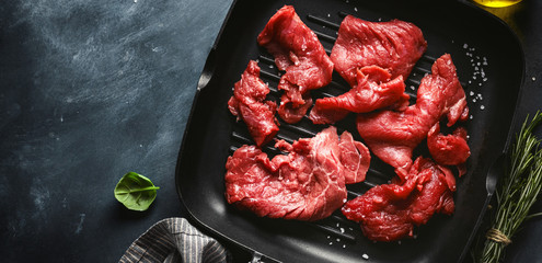 Thin beef slices with ingredients for cooking