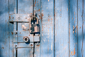 locked latch and padlock on old door
