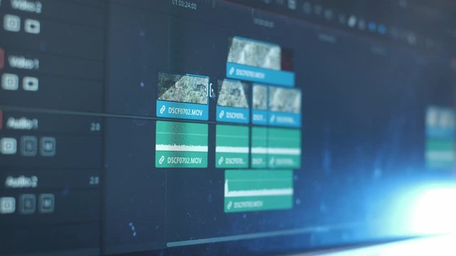 The program interface for video editing. The editor creates a video. Freelancer works at home, creates a movie for the blog, home office during quarantine. Color correction of video footage.