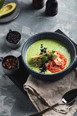 Cream of asparagus soup with shrimp. Green asparagus soup with tiger prawns, Food photo, healthy eating, wholesome food.