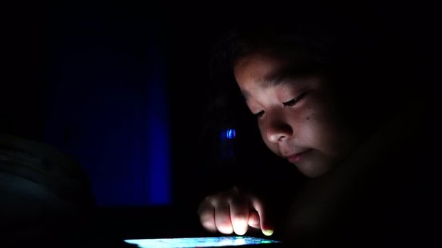 girls lying on bed using smartphone texting on social media browsing online having fun sleepover on stay at home quarantine coronavirus,covid-19 pandemic prevention. 