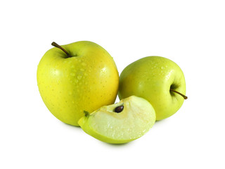 Wet yellow apples covered with water drops and juicy slice isolated on white background    
