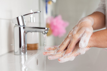 Hygiene concept. Woman washing hands close up. Hand hygiene for coronavirus outbreak. 