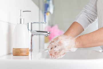 Hygiene concept. Woman washing hands close up. Hand hygiene for coronavirus outbreak. 