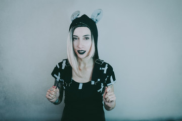 Gothic style portrait of a young woman with cool style