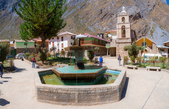 View of the water fountain at the main square of Huancaya town at a sunny day in Lima Region, Peru
