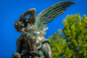 Fountain of the Fallen Angel or Fuente del Angel Caido in the Buen Retiro Park in Madrid, Spain...