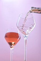Wine being poured in a studio photo.