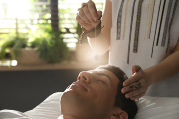 Man during healing session in therapy room