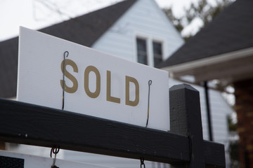 Moncton, New Brunswick, Canada - 29 March 2020 Sold sign. Selling a house. Buy a house. Sell a house. New home.