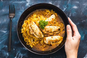 plant-based food, curry noodle soup with vegan dumplings