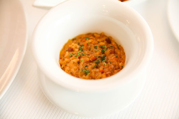 Gourmet creamy Risotto served on a porcelain bowl.