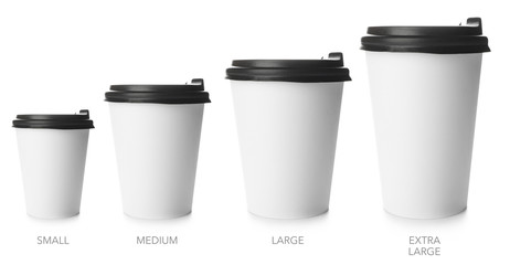 Different sized takeaway coffee cups on white background
