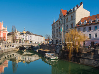 Obraz na płótnie Canvas Ljubljana - capital city of Slovenia, center streets, square, church architecture, bridge Tromostovje