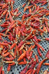 dry red chili on bamboo basket