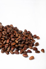 Fresh peeled cedar nuts isolated on white background, closeup