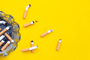 Smoked cigarettes on white background.