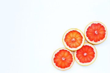 High vitamin C. Juicy grapefruit slices on white