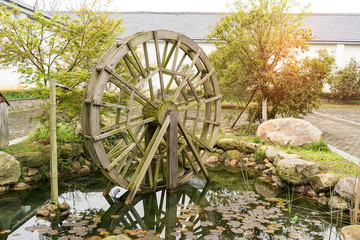 Traditional wooden water wheel spinning