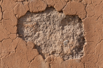 Detail of a cracked clay wall
