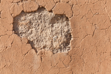 Detail of a cracked clay wall
