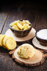 Vegan cheese bread, made in Brazil without animal products, using tapioca (manioc flour) and potatoes. Organic products on rustic wooden background.