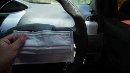 Women holding mask , Protective equipment coronavirus in car