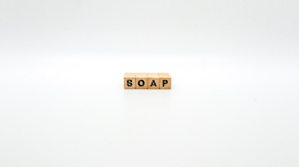 Wooden Text Block of "SOAP" on Isolated Background