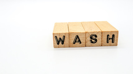 Wooden Text Block of "WASH" on Isolated Background