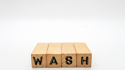 Wooden Text Block of "WASH" on Isolated Background