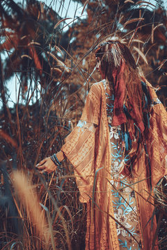 beautiful young boho gypsy style woman outdoors